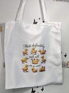 MOST DEFINITELY NOT ALL IN A ROW TOTE BAG